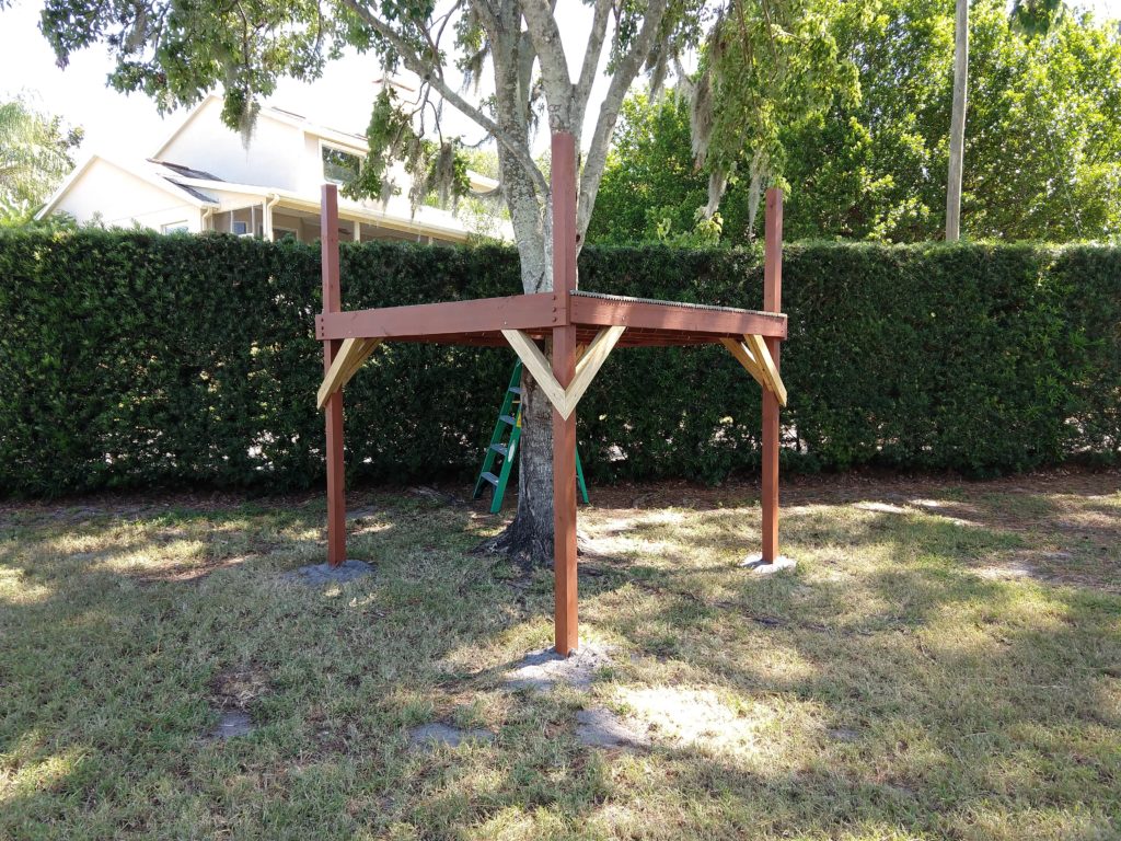 8 foot by 8 foot play structure around a tree