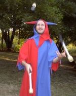 Jay dressed in a Jester garb juggling